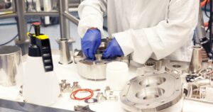 Sealing technologies expert replacing custom seal in cleanroom